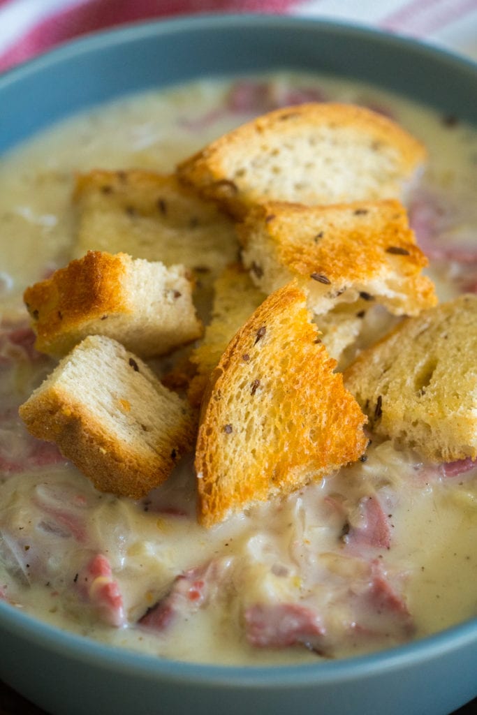 Creamy Reuben Soup Topped with Bread