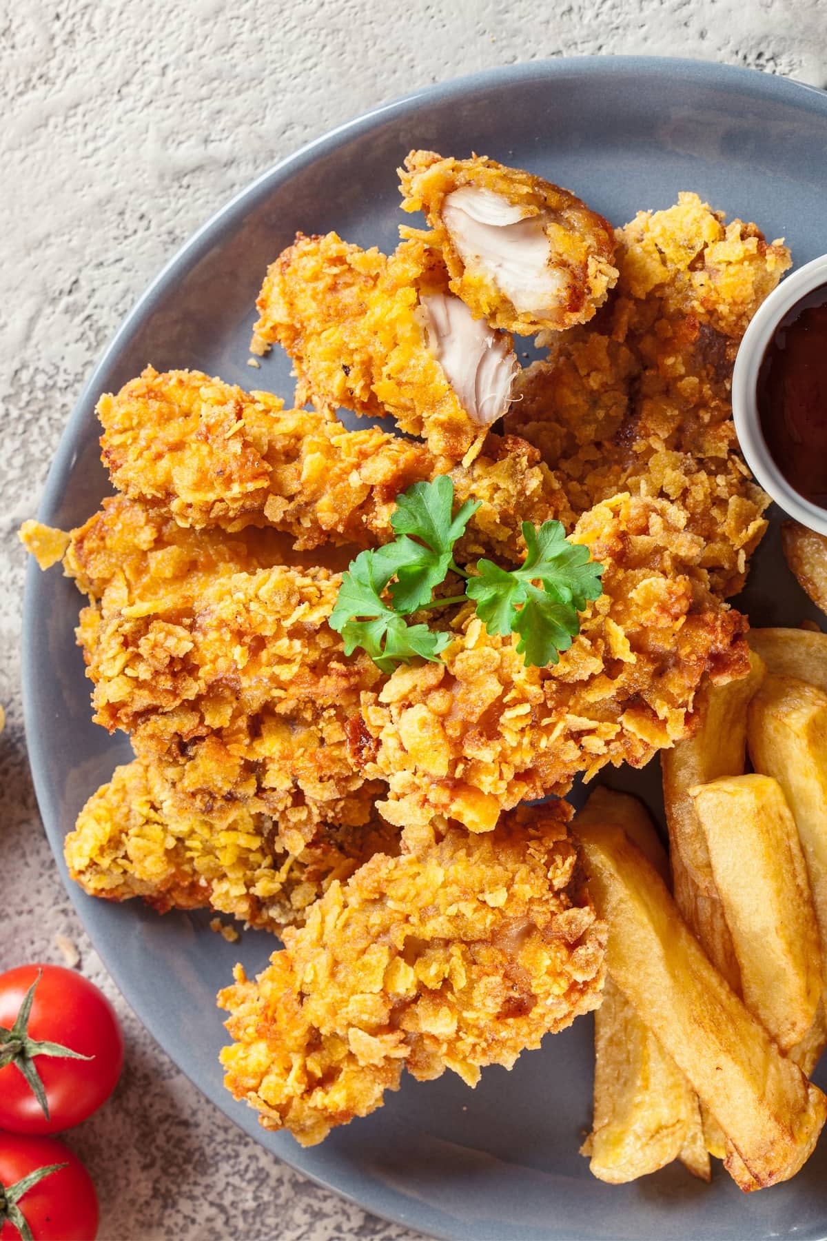 Crispy Fried Chicken with Bread Crumbs Served with Fries and Ketchup