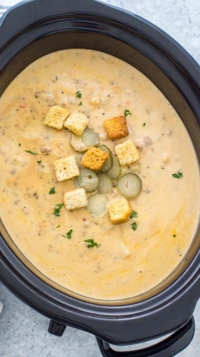 Top view of cheeseburger soup in a Crockpot. 