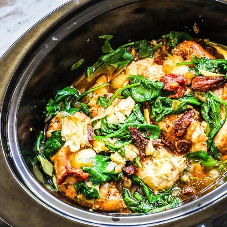 Crockpot Tuscan Chicken with artichoke hearts, sun dried tomatoes and baby spinach