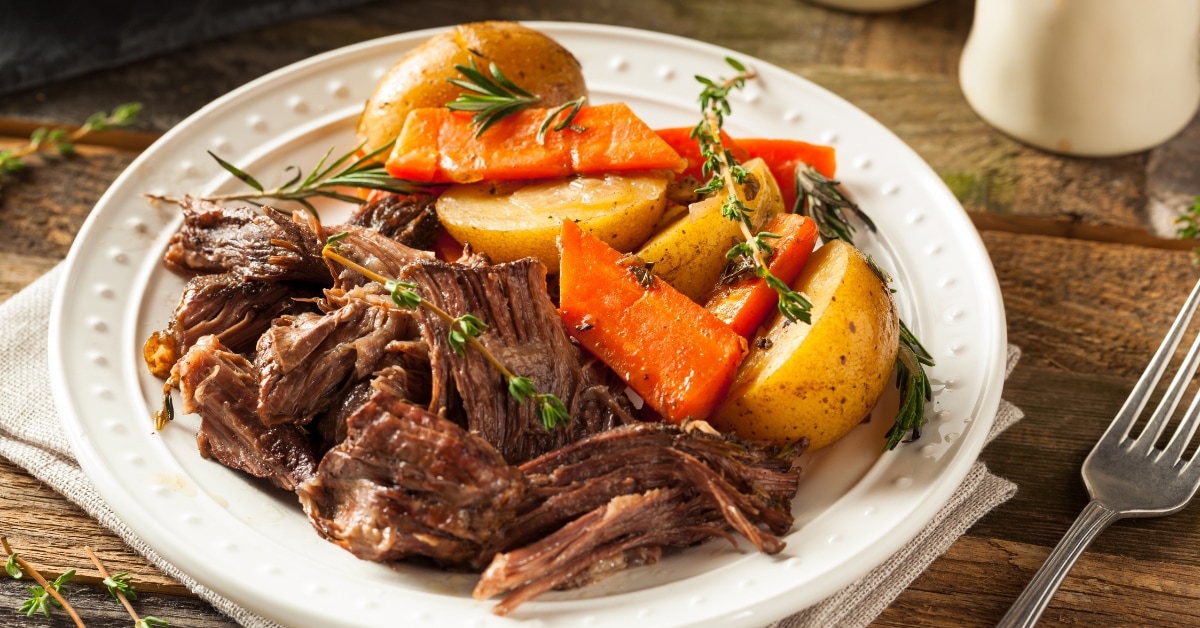 https://insanelygoodrecipes.com/wp-content/uploads/2023/11/Delicious-Pot-Roast-Beef-with-Carrots-and-Potatoes.jpg