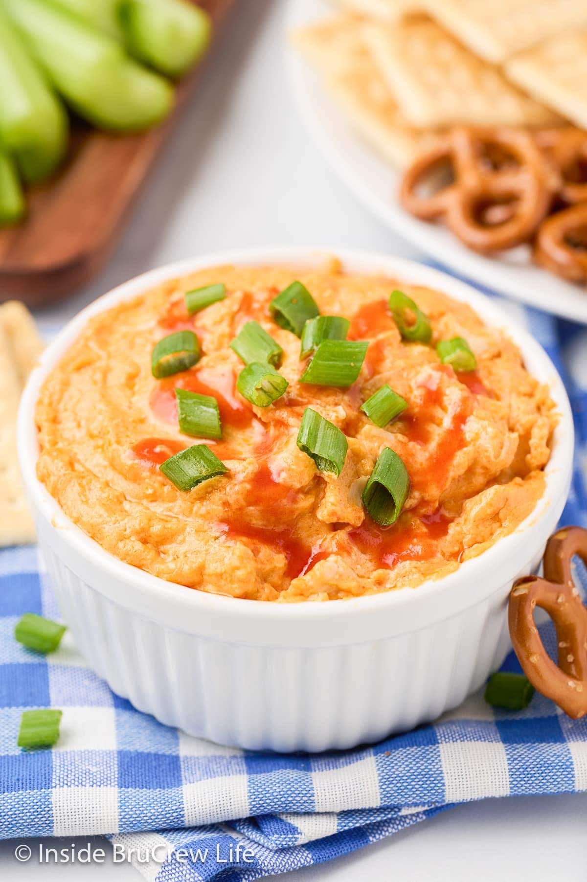 Bowl of Easy Buffalo Chicken Dip topped with chopped green onions