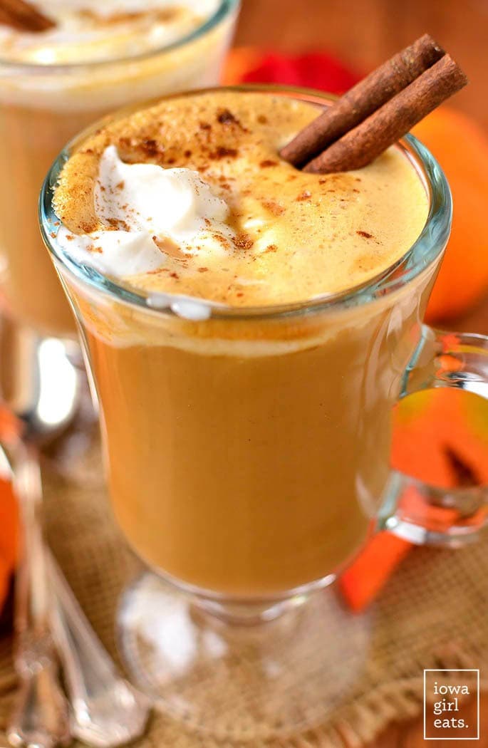 Pumpkin spice latte in a glass mug. 