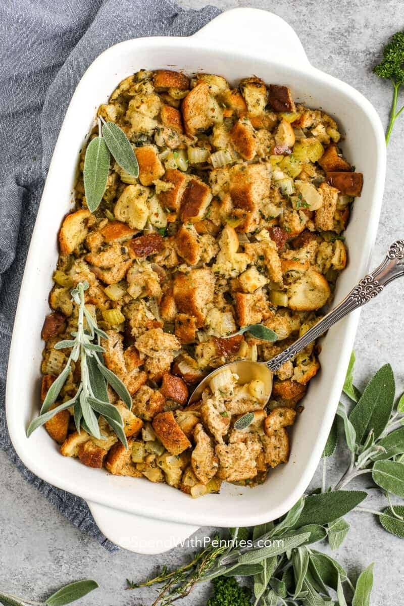 Stuffing in casserole dish with celery, crumbled bread and spices. 