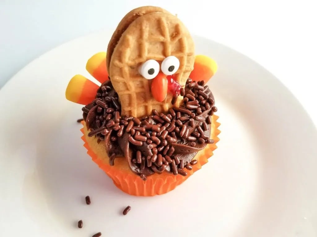 Decorated turkey cupcake made with Nutter Butters, candy eyeballs, Reese’s Pieces, candy corn, and sprinkles. 