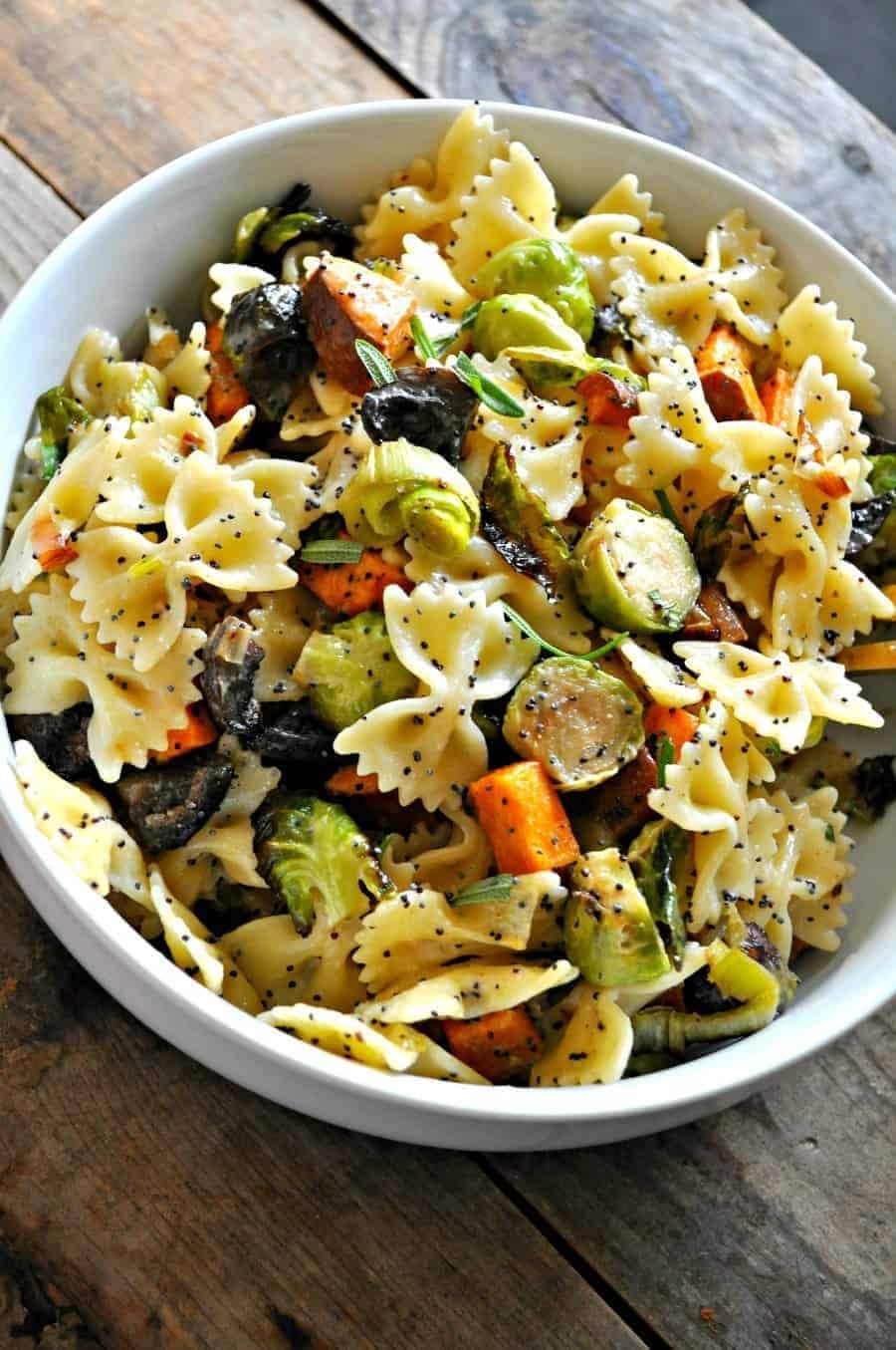 Bowl of fall pasta salad with roasted vegetables and soft pasta. 