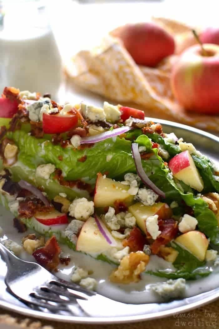 Apple wedge salad with chopped walnuts, crispy bacon, and gorgonzola cheese. 