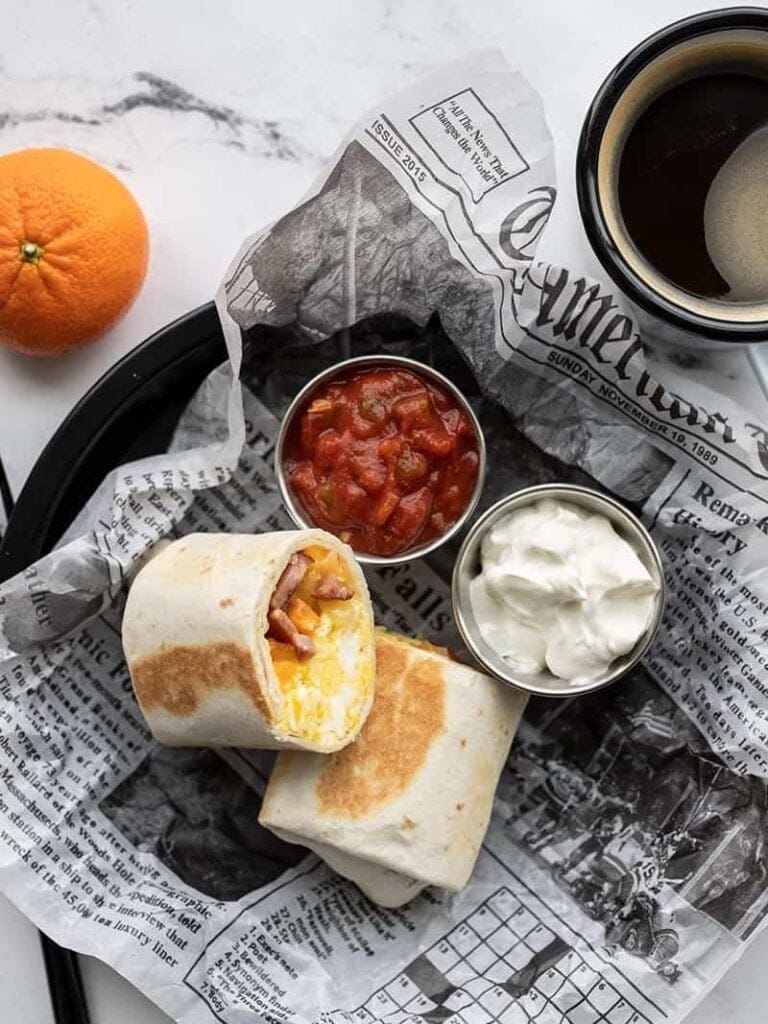 Breakfast burrito with dips. 