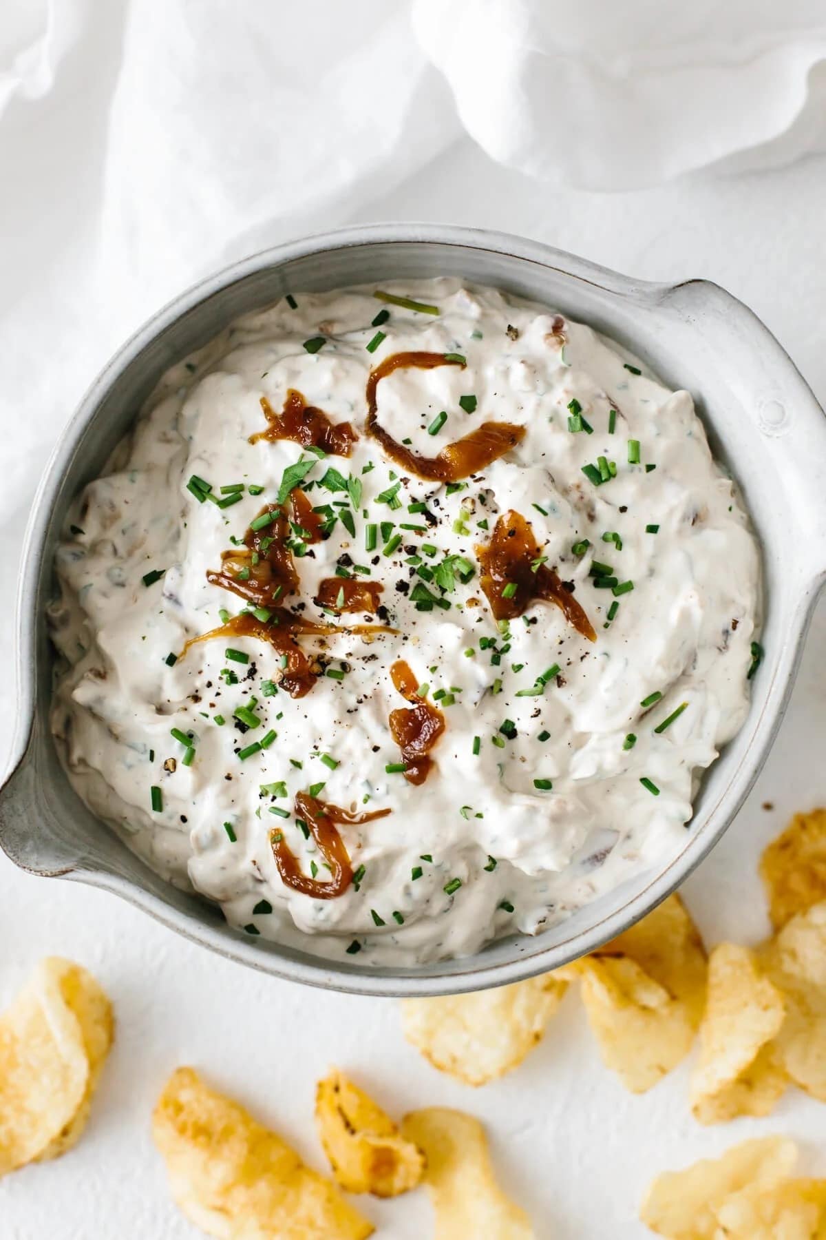 Top view of creamy French onion dip on a bowl. 