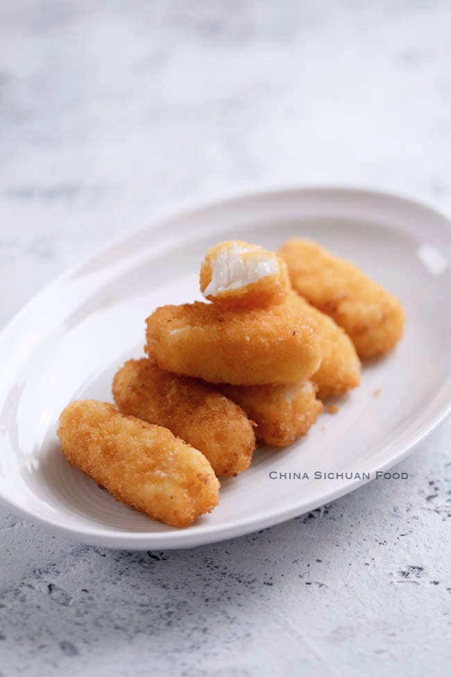 A plate of golden fried milk placed on a table, ready to be savored