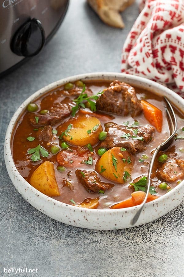 Slow-Cooker Beef Stew with carrots, potatoes, green peas and parsley