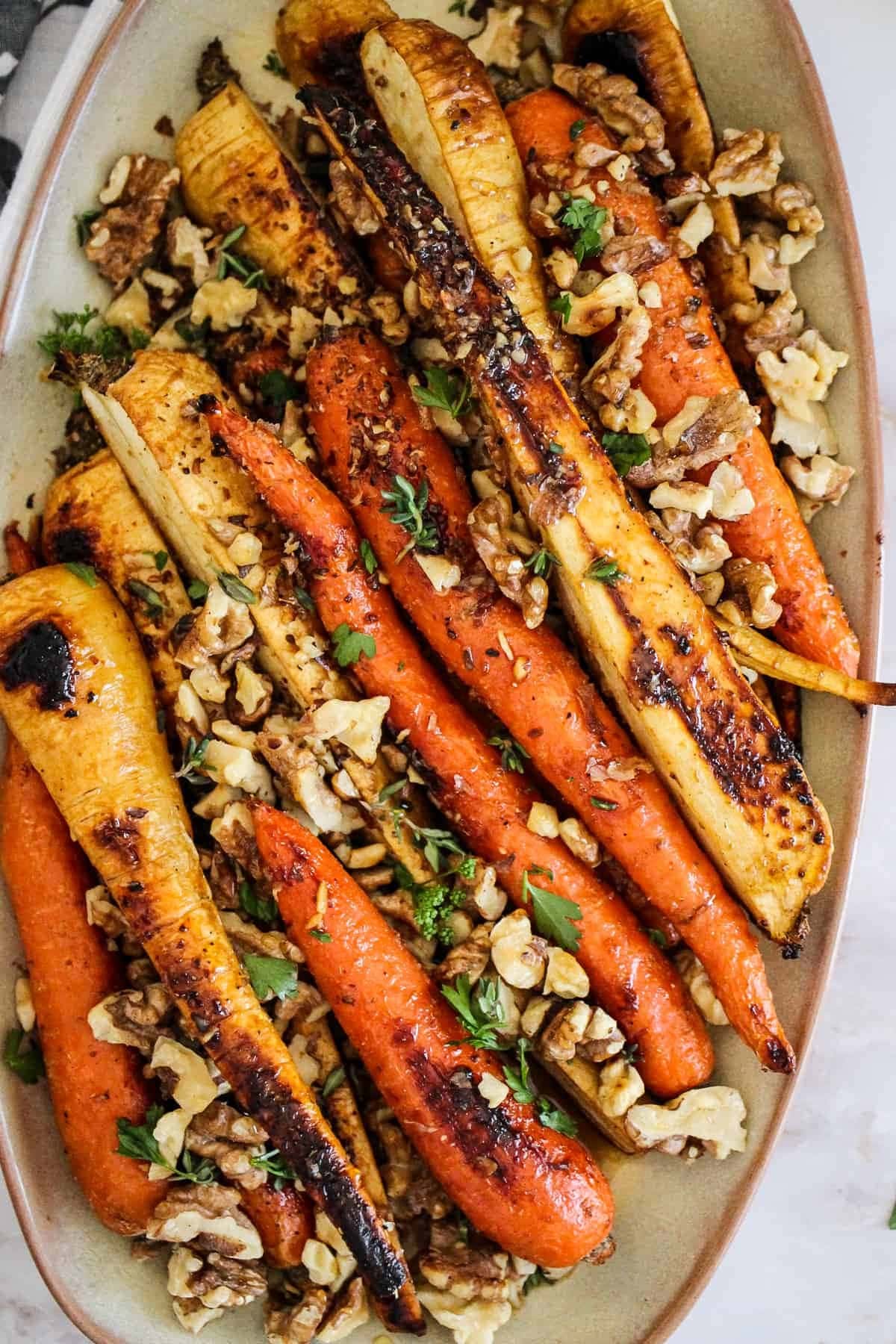 Honey roasted carrots and parsnips with honey, spices and walnuts. 
