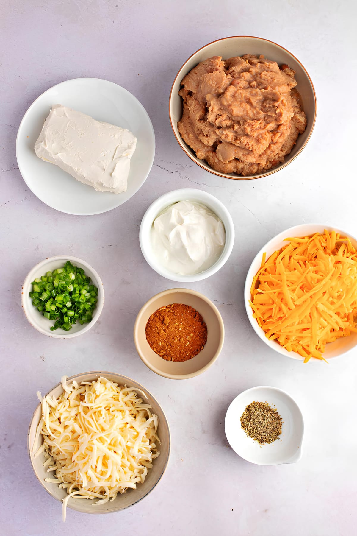 Hot Bean Dip Ingredients - Cream Cheese, Sour Cream, Refried Beans, Onions, Taco Seasoning, Salsa and Hot Pepper Sauce