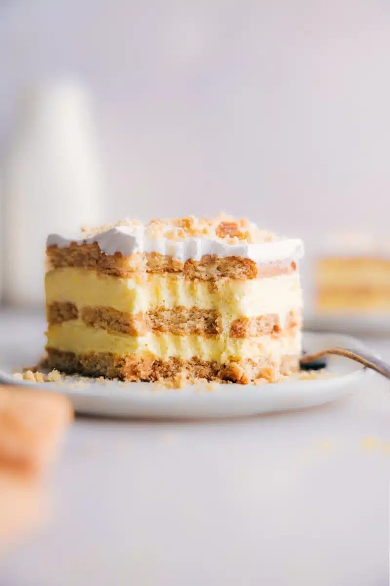 Close up view of a slice of Lemon Icebox Cake on a saucer