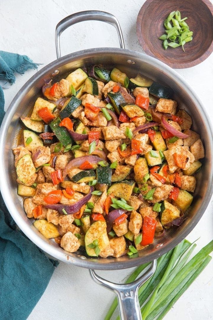 Mexican chicken and zucchini skillet in a stainless pot. 
