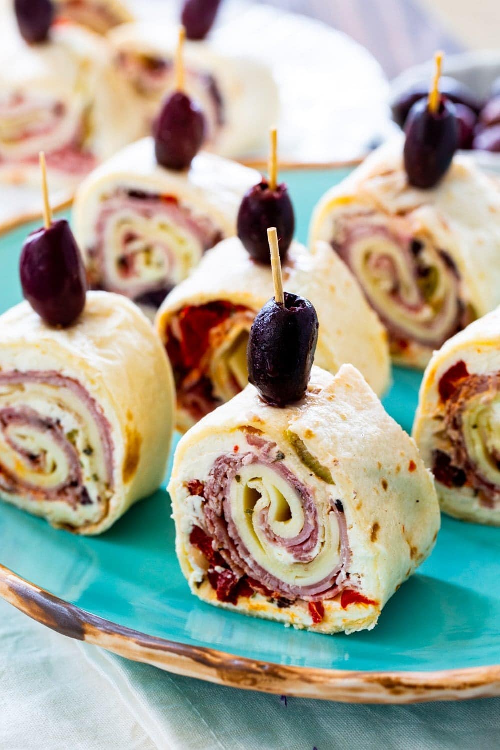 Muffuletta Pinwheels with Olives, Peppers, Onions and Meat