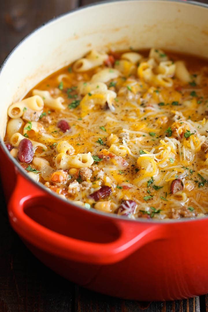 Chili mac and cheese on a red pot. 