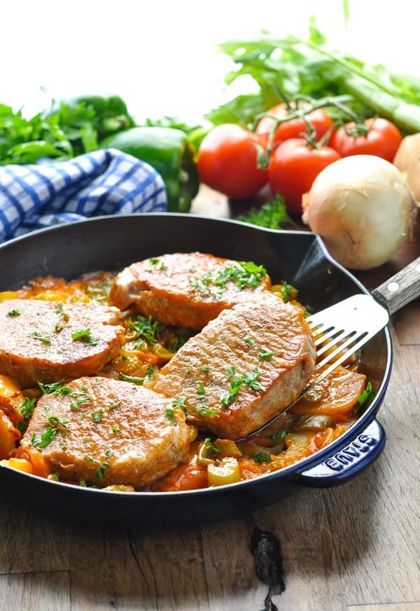 Serving of One-pot southern pork chop cooked in a pan. 