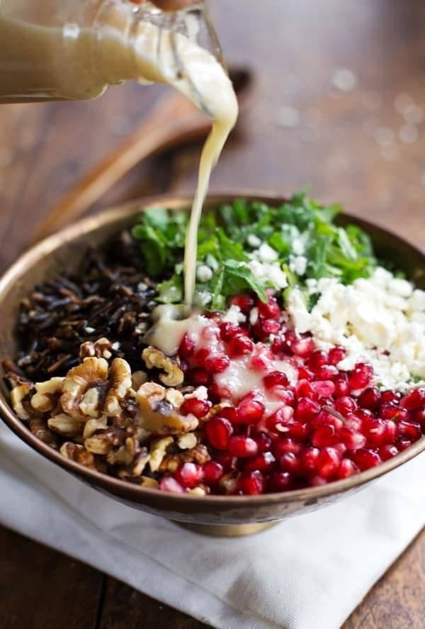 Bowl of homemade Pomegranate Salad with Kale, Wild Rice, and Feta
