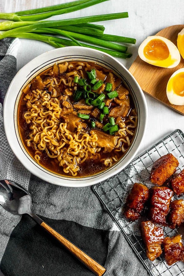 Pork Belly Ramen with Noodles and Green Onions Served with Egg