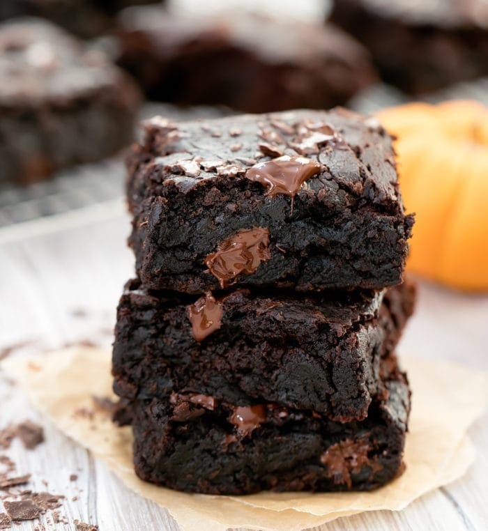 Stack of a chocolatey pumpkin brownies.