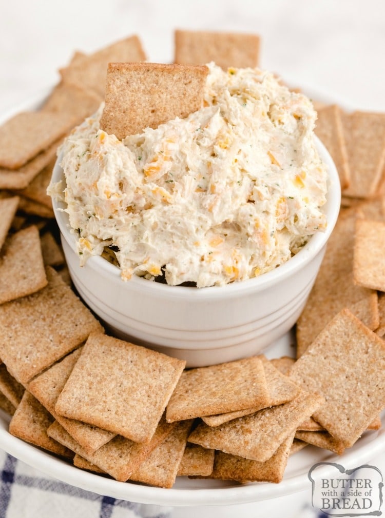 Bowl of Ranch Chicken Cheese Dip with bunch of crackers on the side