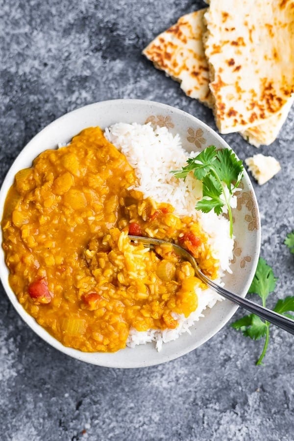 White rice served with red lentil dal.