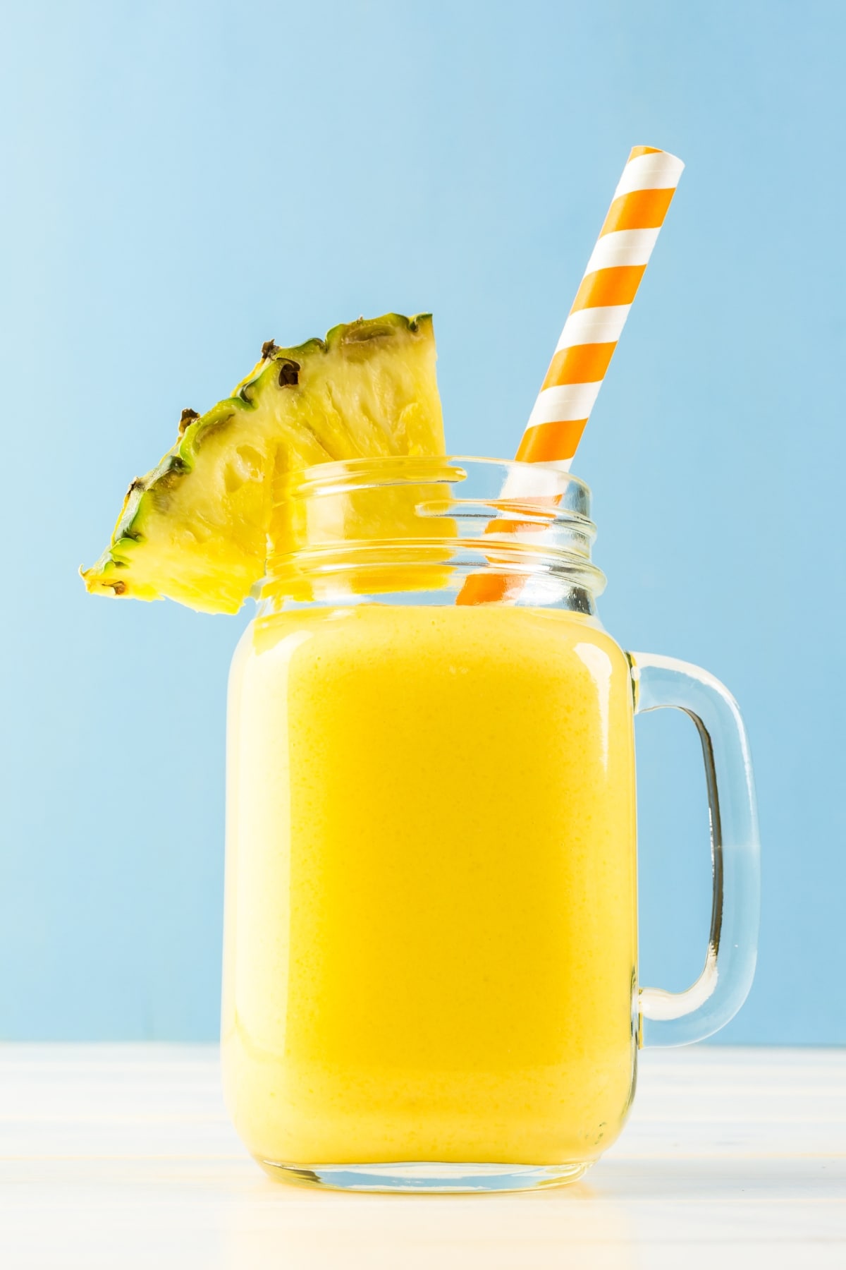 Refreshing Pineapple Smoothie with Fresh Fruit in a Glass Jar