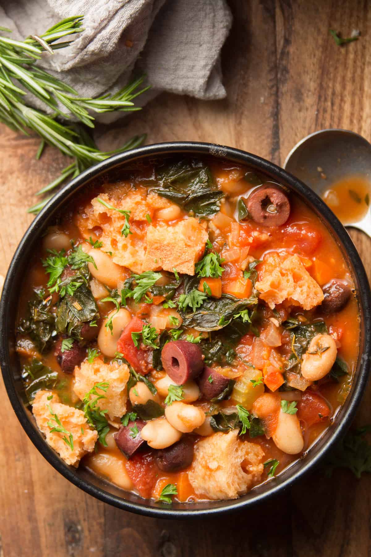 Bowl of Ribollita Soup with Diced Onions, Carrots, Celery Stalks and Cannellini Beans