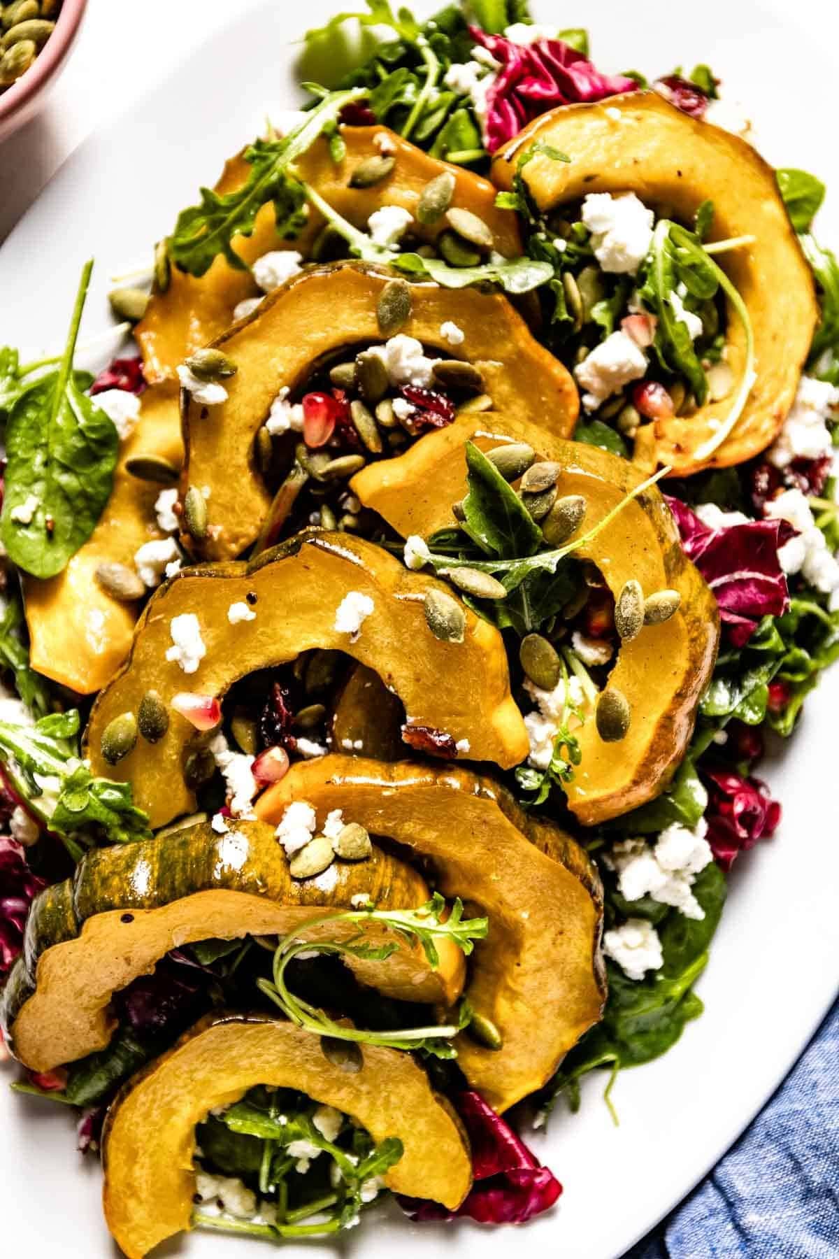 Roasted Acorn Squash Salad with Spicy Pepitas and Cranberries