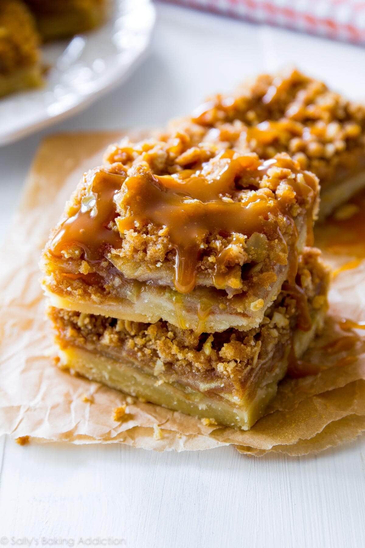 Salted caramel apple pie bars drizzled with caramel syrup. 