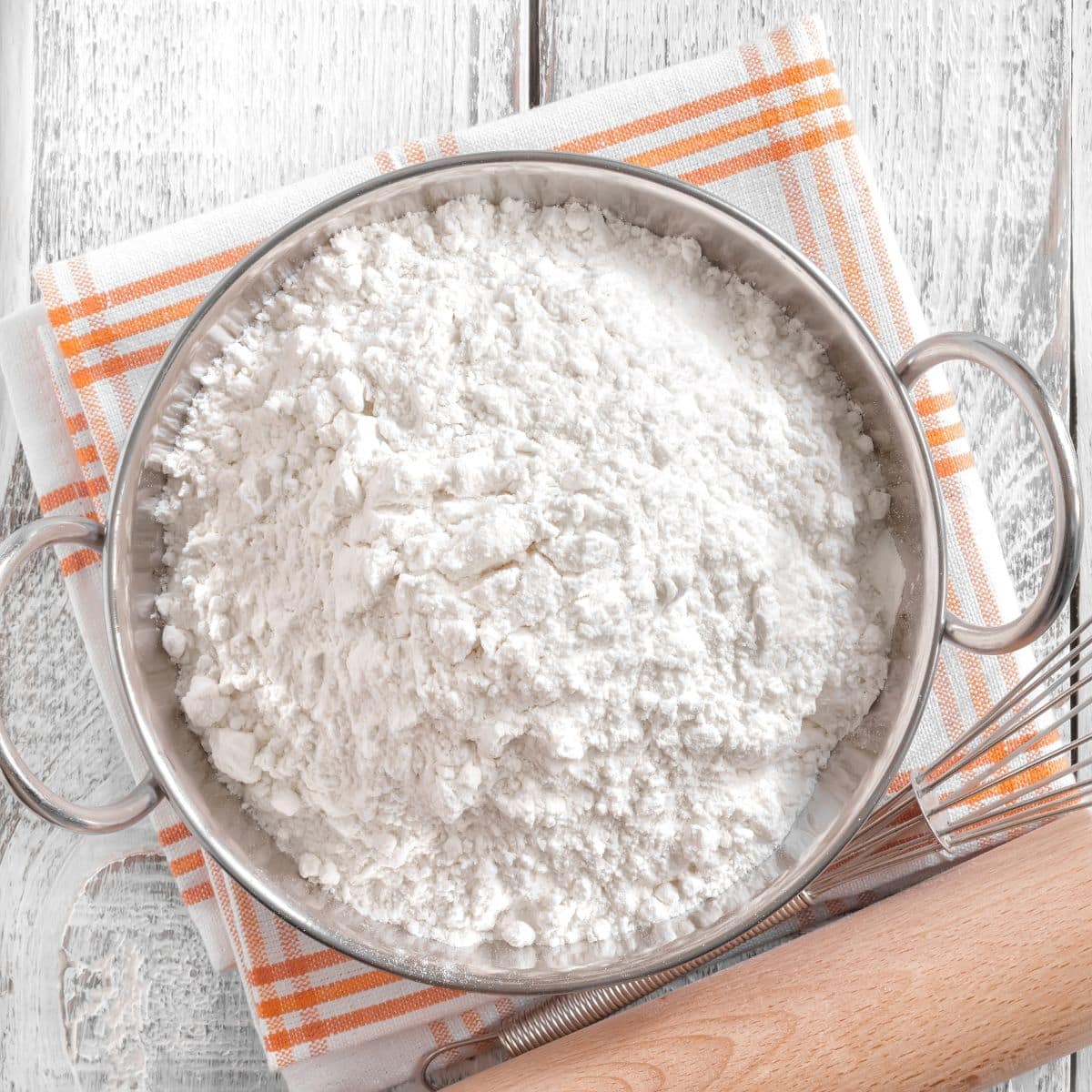 Self-Rising Flour to a Bar with Whisk and Rolling Pin