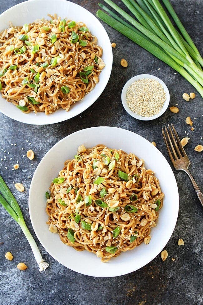 Sesame Noodles with Nuts and Scallions in a White Bowl