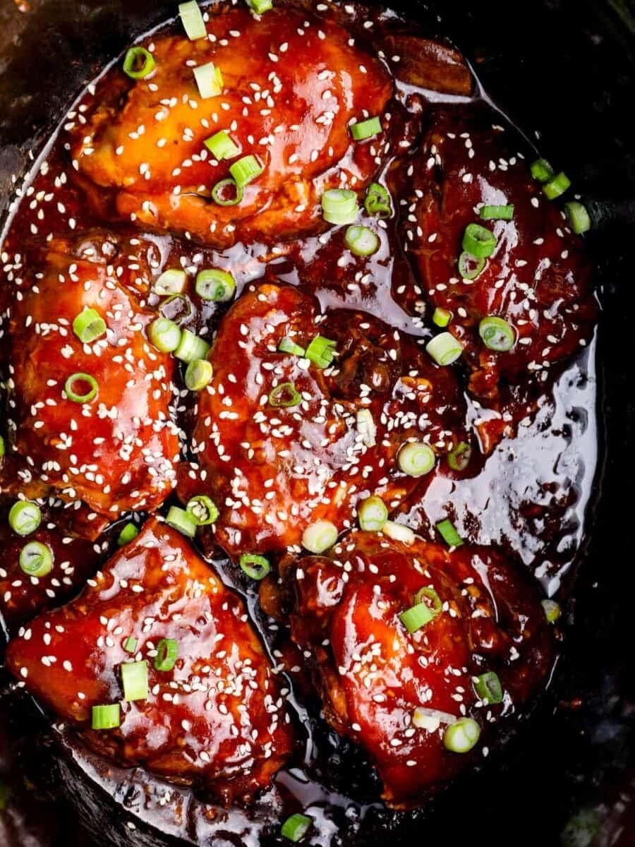Slow Cooker Honey Garlic Chicken with sesame seeds and green onions for toppings