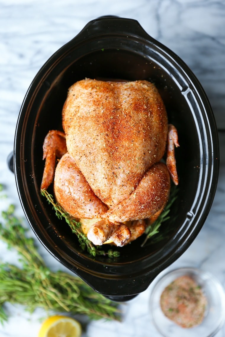 Slow Cooker Rotisserie Chicken with seasoning, rosemary and thyme