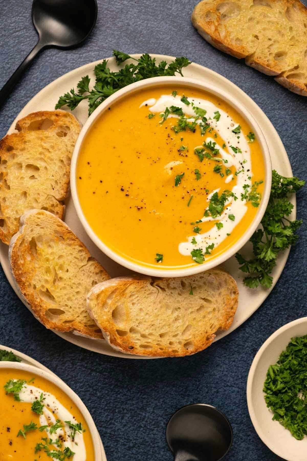 Bowl of Creamy Sweet Potato Soup Served with Bread
