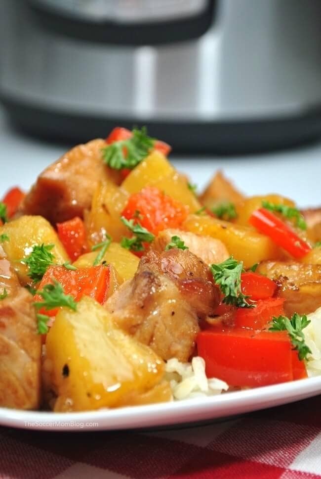 Sweet and Sour Pork Served with Rice and Tomatoes