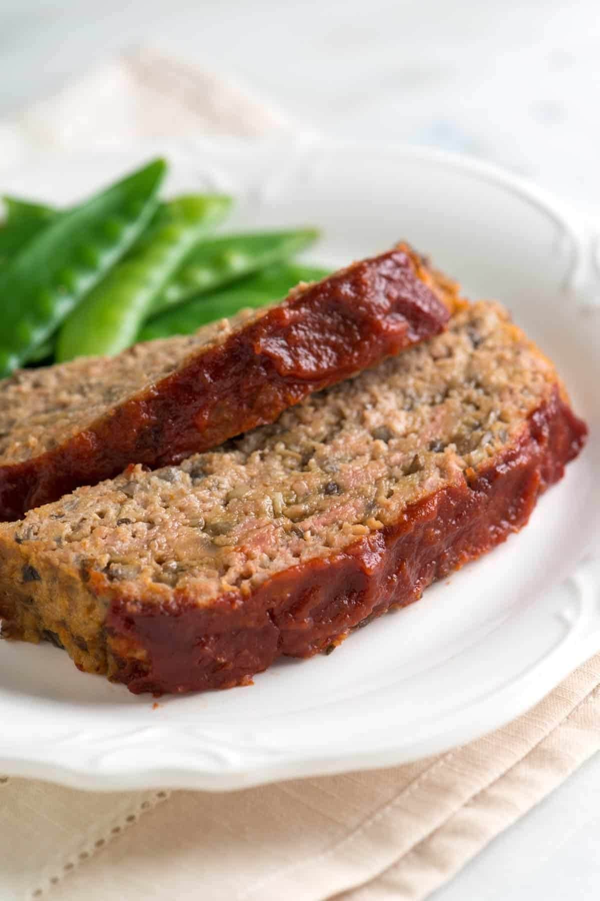 Two slices of turkey meatloaf. 