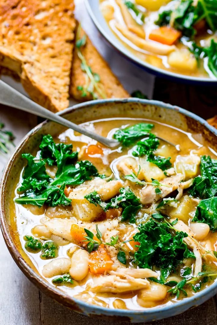 Tuscan- style chicken soup on a bowl. 