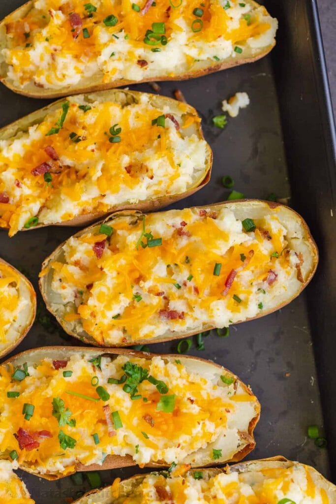 Twiced-baked potatoes in a baking pan. 