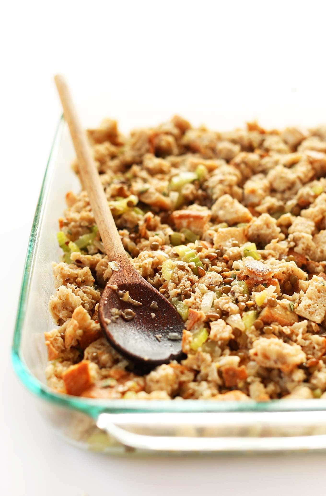Vegan stuffing with celery, sage, onions and whole grain bread on a glass dish.  