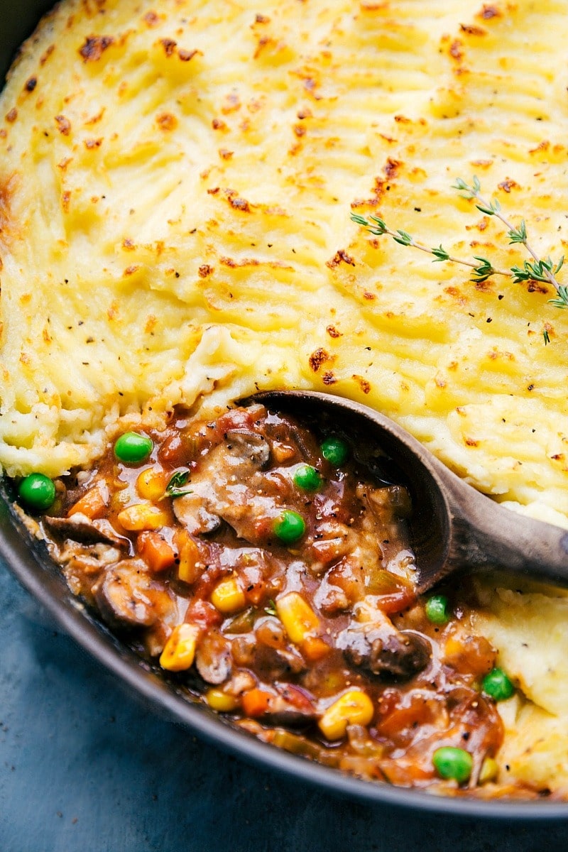 Shepherd's Pie filled with a savory meat and vegetables topped with melting cheese. 
