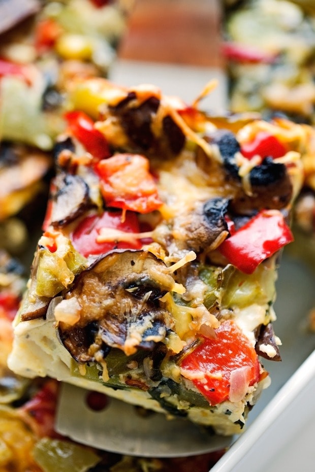 Veggie-loaded breakfast casserole with mushrooms, bell pepper, spinach, potatoes, and onions.