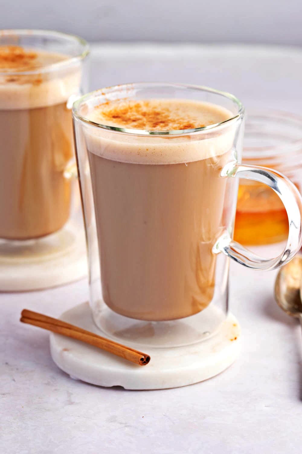 Honey Coffee (Easy and Delicious!) featuring Two Clear Mugs of Warm Homemade Honey Coffee with Cinnamon