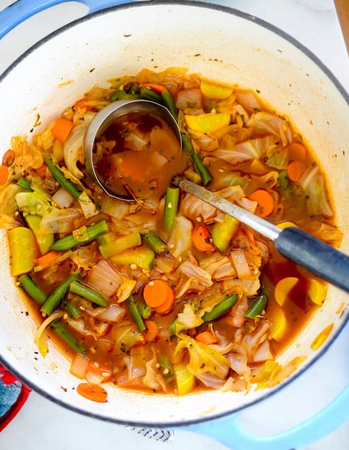 Bowl of Cabbage Soup with Carrots and Green Beans