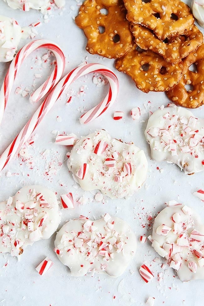White Chocolate Peppermint Pretzels with candy cane on the side