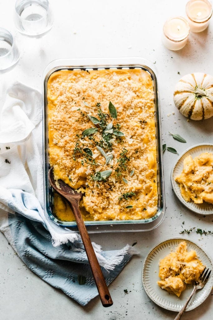 Baked butternut squash mac and cheese cooked on a glass dish.