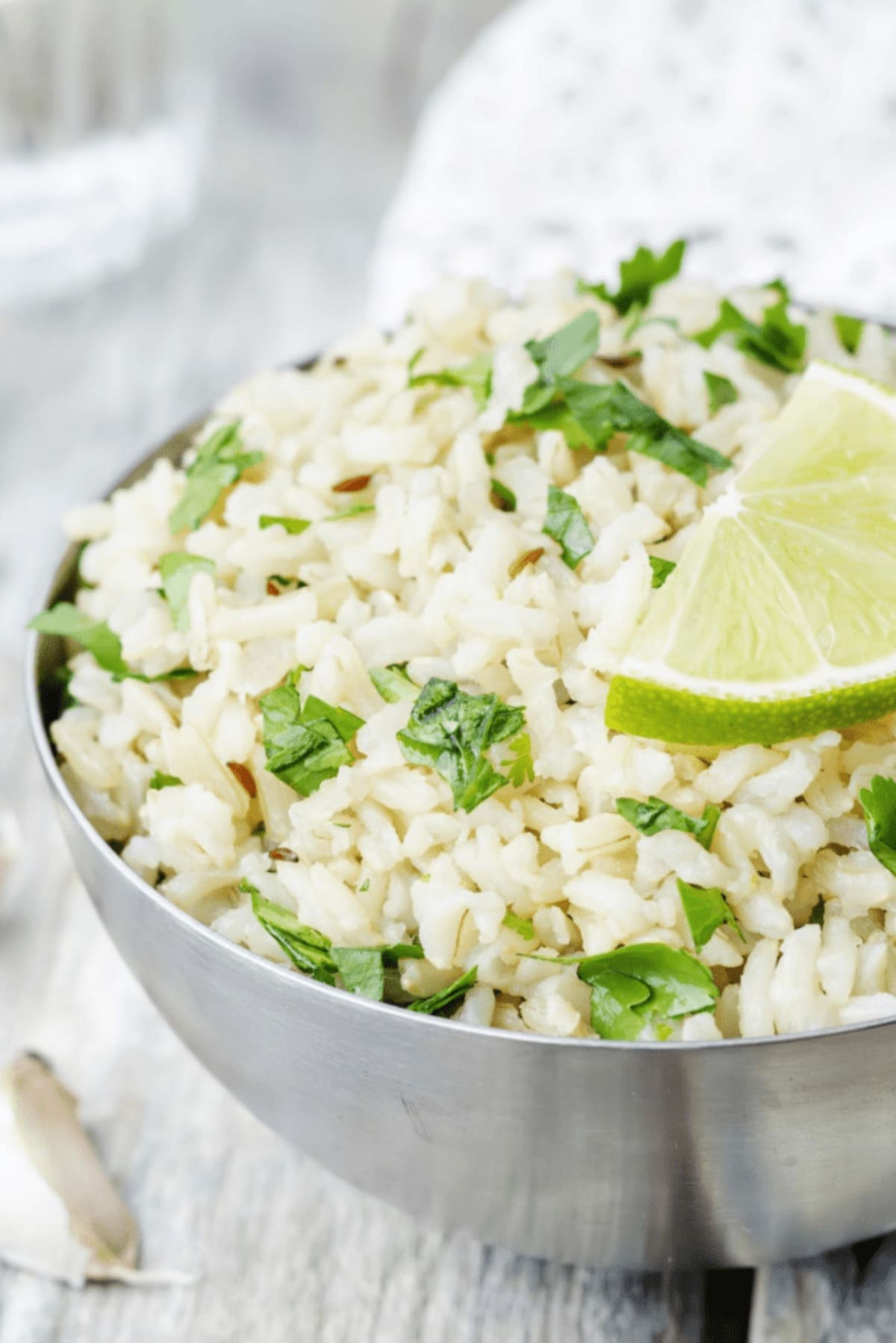 bowl of rice with cilantro and lime