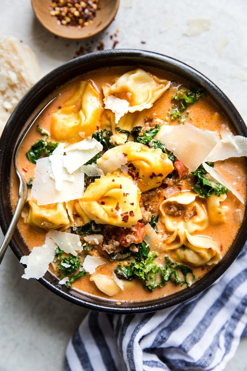 Homemade Creamy Tortellini Soup with Italian Sausage and Kale in a Bowl
