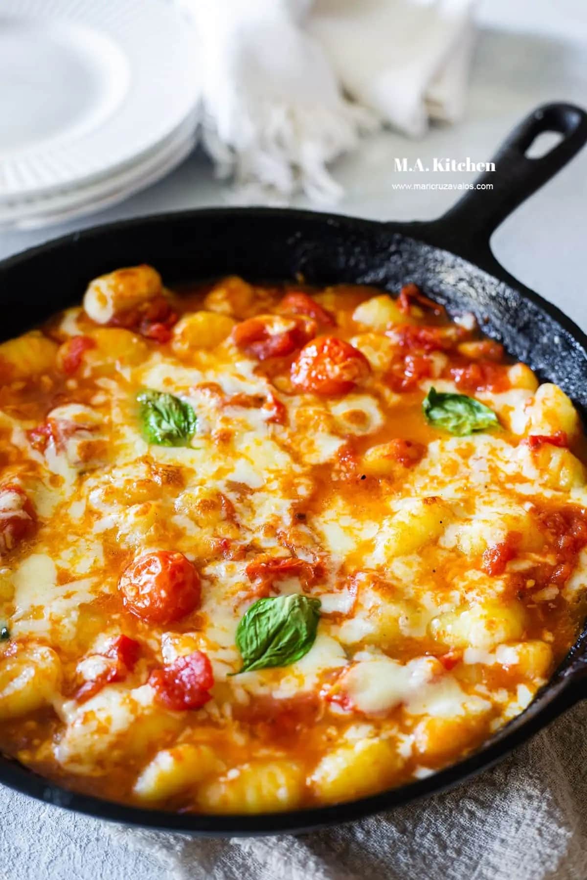 Potato Dumplings in Zesty Sauce and Cheese Garnished with Fresh Basil